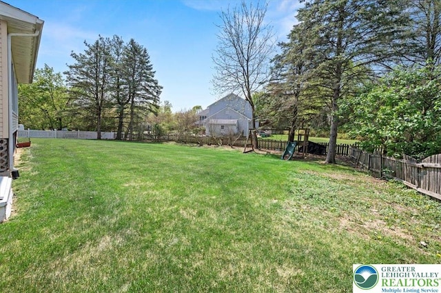view of yard with a fenced backyard
