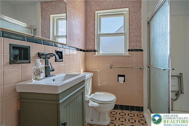 full bathroom with tile walls, tile patterned flooring, and a stall shower