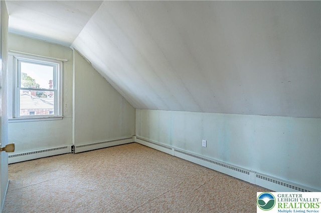 bonus room featuring lofted ceiling and carpet flooring