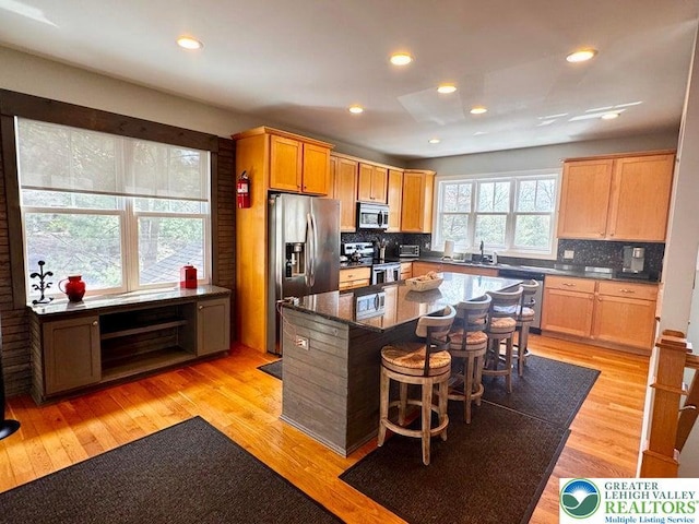 149 Longview Dr, Kidder Township S, PA 18624 - kitchen with a kitchen island, tasteful backsplash, appliances with stainless steel finishes, and a kitchen bar