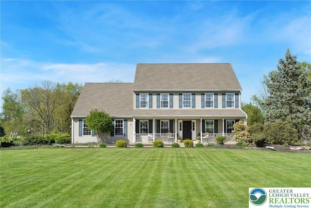 2735 Limeport Rd, Milford Twp, PA 18951 - colonial-style house featuring a front yard, a porch, and a shingled roof