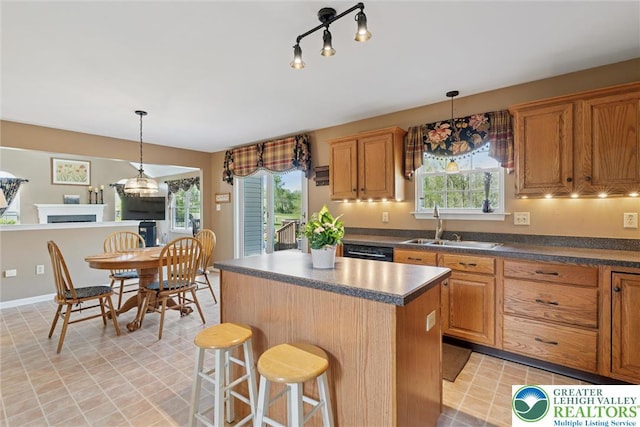 2735 Limeport Rd, Milford Twp, PA 18951 - kitchen with a sink, dark countertops, a center island, and a healthy amount of sunlight