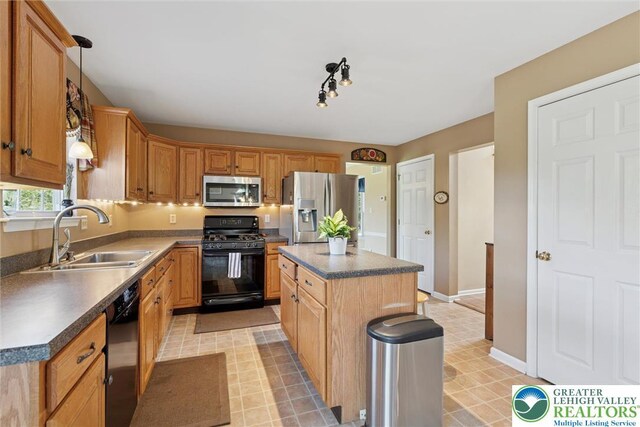 2735 Limeport Rd, Milford Twp, PA 18951 - kitchen with light floors, a kitchen island, black appliances, and a sink