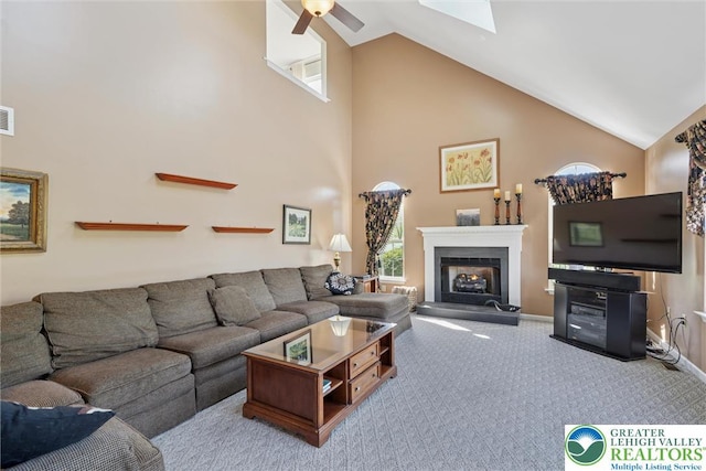 2735 Limeport Rd, Milford Twp, PA 18951 - carpeted living room featuring plenty of natural light, a fireplace with raised hearth, visible vents, ceiling fan, and high vaulted ceiling