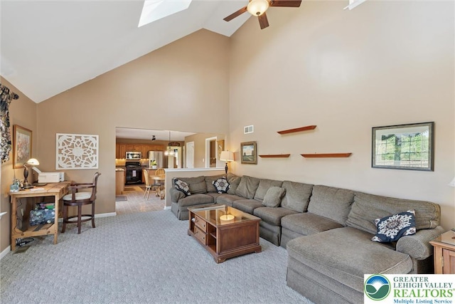 2735 Limeport Rd, Milford Twp, PA 18951 - living area with a ceiling fan, high vaulted ceiling, visible vents, baseboards, and light carpet