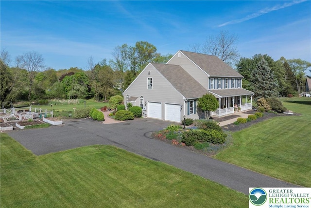 2735 Limeport Rd, Milford Twp, PA 18951 - view of property exterior featuring covered porch, roof with shingles, an attached garage, driveway, and a yard