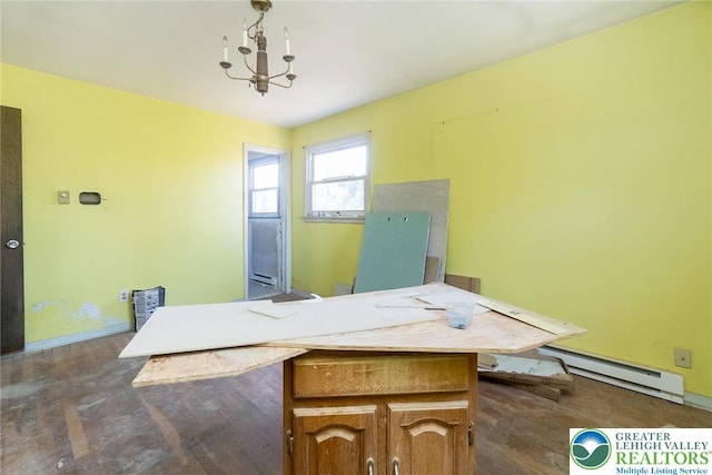 home office with a baseboard radiator and an inviting chandelier