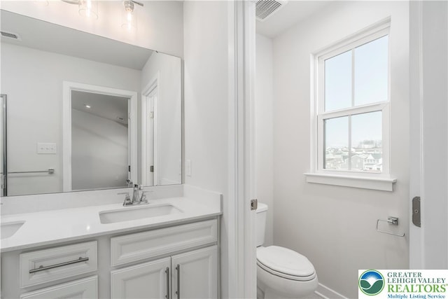 1022 Watson Ct, Upper Macungie Twp, PA 18051 - bathroom with toilet, double vanity, and baseboards