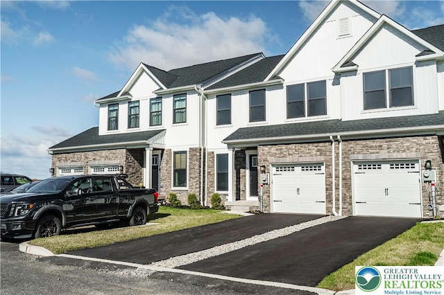 1022 Watson Ct, Upper Macungie Twp, PA 18051 - townhome / multi-family property featuring a garage, stone siding, driveway, and a shingled roof