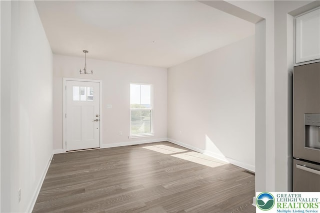 1022 Watson Ct, Upper Macungie Twp, PA 18051 - entryway featuring wood finished floors, a chandelier, and baseboards