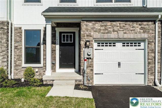 1022 Watson Ct, Upper Macungie Twp, PA 18051 - doorway to property with stone siding and a shingled roof