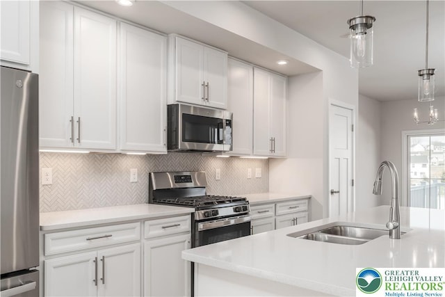 1022 Watson Ct, Upper Macungie Twp, PA 18051 - kitchen featuring appliances with stainless steel finishes, a sink, light countertops, and tasteful backsplash