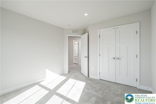 1022 Watson Ct, Upper Macungie Twp, PA 18051 - unfurnished bedroom with light colored carpet, baseboards, a closet, and recessed lighting