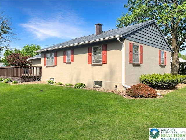 3426 Wilson Ave, South Whitehall Twp, PA 18069 - view of property exterior with a yard, a wooden deck, stucco siding, and a chimney