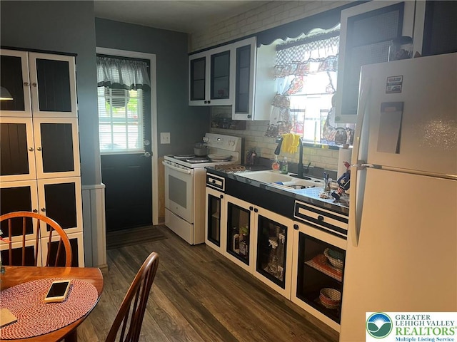 3426 Wilson Ave, South Whitehall Twp, PA 18069 - kitchen with glass insert cabinets, dark wood-style flooring, white appliances, a sink, and tasteful backsplash
