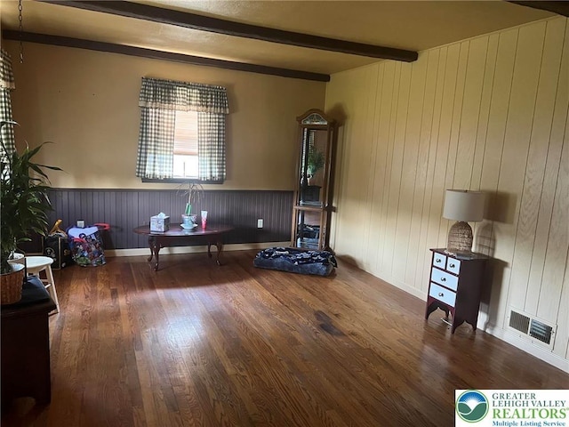 3426 Wilson Ave, South Whitehall Twp, PA 18069 - living area featuring baseboards, beam ceiling, visible vents, and wood finished floors