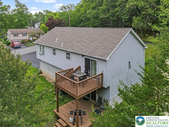 838 Cayuga Way, Stroud Twp, PA 18360 - back of house featuring a wooden deck and roof with shingles