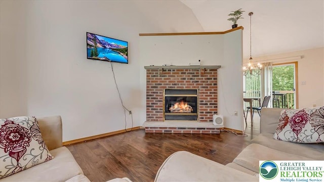 838 Cayuga Way, Stroud Twp, PA 18360 - living area with lofted ceiling, a chandelier, wood finished floors, and a fireplace