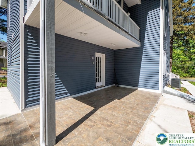view of patio / terrace with a balcony and cooling unit