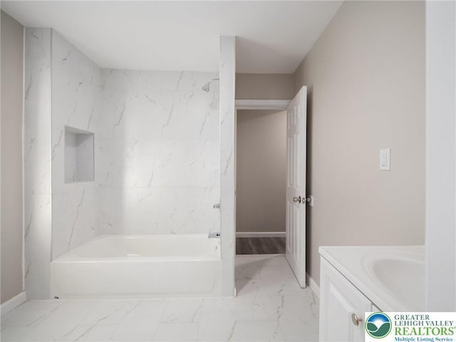 full bathroom featuring baseboards, marble finish floor, shower / bath combination, and vanity