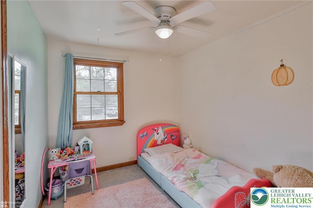 bedroom with carpet flooring, baseboards, and a ceiling fan