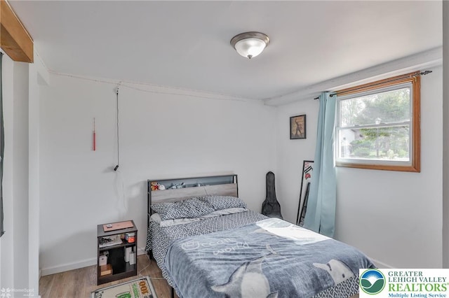 bedroom featuring wood finished floors