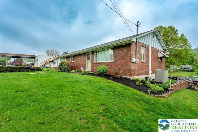 1804 Long Run Rd, Pa, PA 17972 - rear view of property featuring a yard, central air condition unit, and brick siding