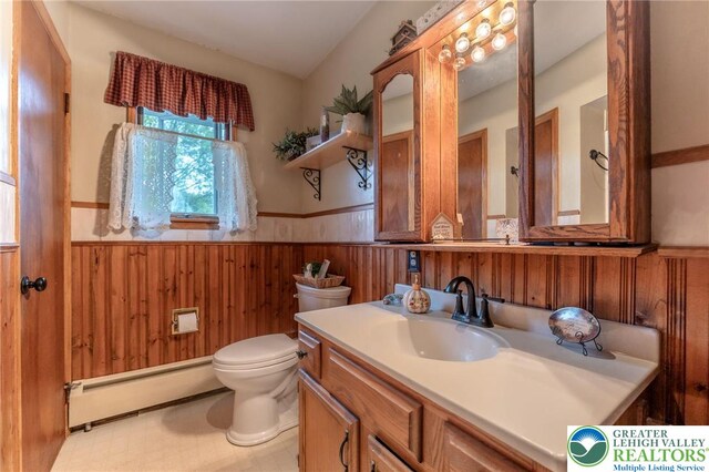 1804 Long Run Rd, Pa, PA 17972 - bathroom with a baseboard radiator, toilet, wainscoting, wooden walls, and vanity