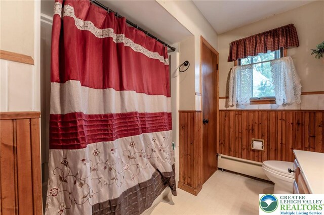 1804 Long Run Rd, Pa, PA 17972 - bathroom featuring toilet, a wainscoted wall, tile patterned floors, curtained shower, and a baseboard heating unit