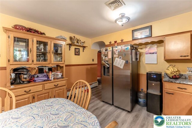 1804 Long Run Rd, Pa, PA 17972 - kitchen with glass insert cabinets, stainless steel fridge with ice dispenser, light wood-type flooring, and visible vents