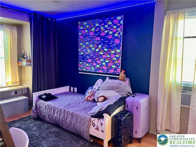 bedroom with wood finished floors