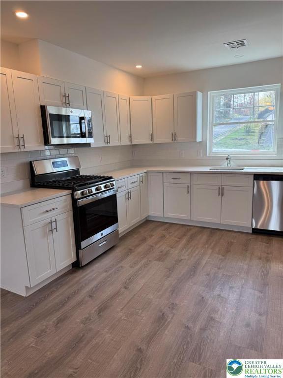 419 W Lincoln, Easton, PA 18042 - kitchen featuring a sink, visible vents, recessed lighting, light countertops, and appliances with stainless steel finishes