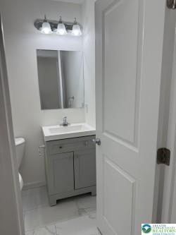 419 W Lincoln, Easton, PA 18042 - half bath with vanity, toilet, and marble finish floor