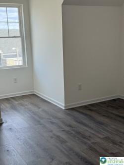 419 W Lincoln, Easton, PA 18042 - spare room featuring dark wood-style flooring and baseboards