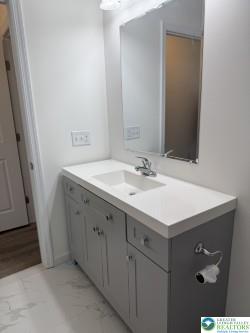 419 W Lincoln, Easton, PA 18042 - bathroom featuring vanity and marble finish floor