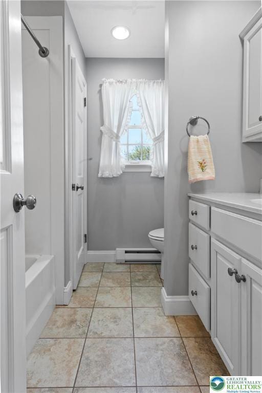 full bath with toilet, baseboards, vanity, and a baseboard heating unit