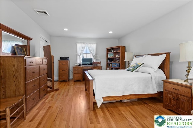 bedroom with visible vents, light wood-style flooring, and recessed lighting