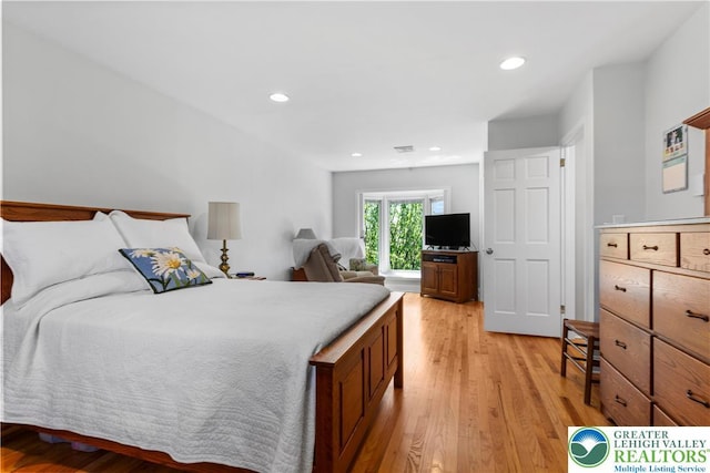 bedroom with recessed lighting, visible vents, and light wood-type flooring