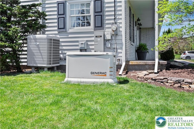 details featuring a power unit, cooling unit, brick siding, and electric meter