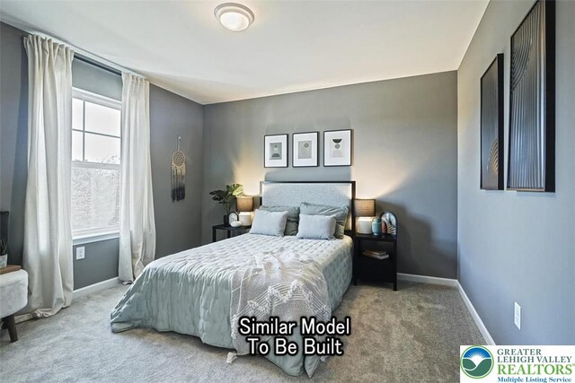 bedroom featuring carpet flooring and baseboards