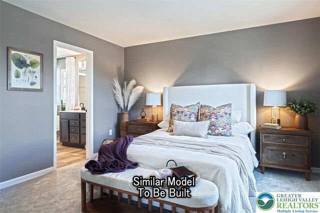 bedroom with connected bathroom, baseboards, and carpet floors