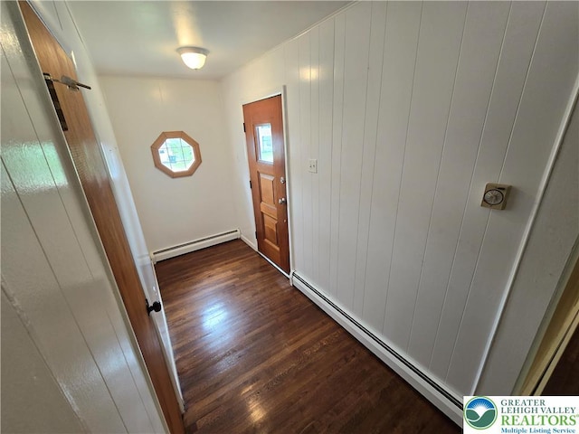 doorway featuring dark wood-style flooring and baseboard heating