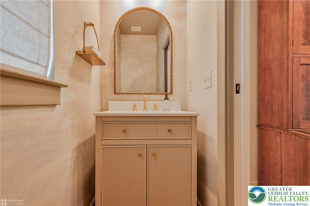 bathroom featuring vanity and visible vents