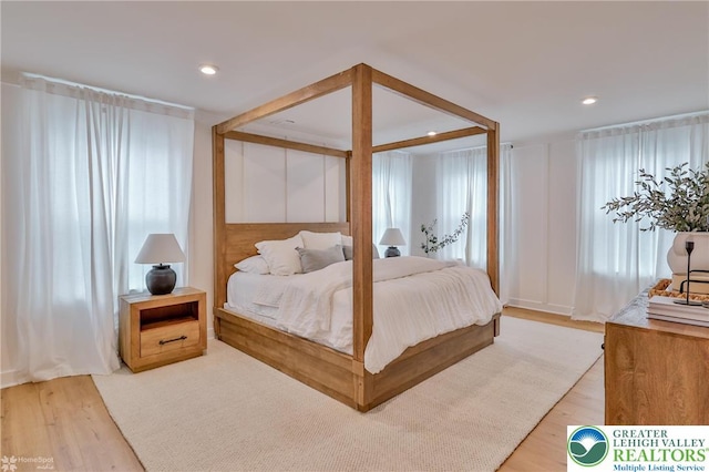 bedroom featuring recessed lighting and wood finished floors