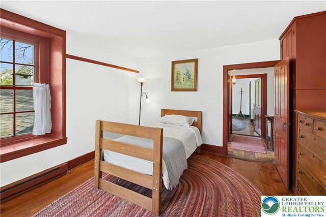 8043 Richlandtown Rd, East Rockhill Twp, PA 18951 - bedroom featuring dark wood finished floors, a baseboard heating unit, and baseboards