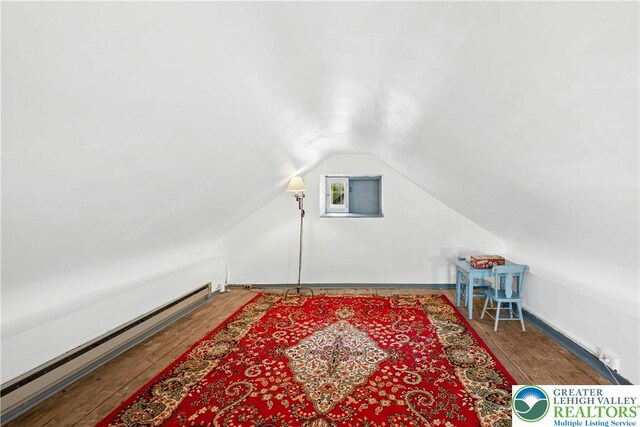 8043 Richlandtown Rd, East Rockhill Twp, PA 18951 - bonus room featuring a baseboard heating unit, lofted ceiling, and hardwood / wood-style floors