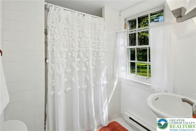 8043 Richlandtown Rd, East Rockhill Twp, PA 18951 - bathroom featuring baseboard heating, plenty of natural light, a shower with curtain, and tile walls