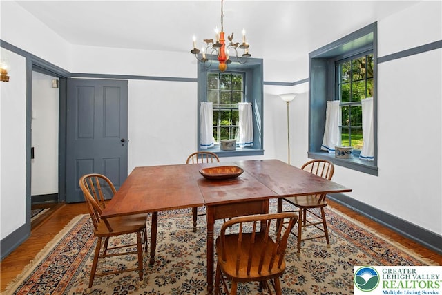 8043 Richlandtown Rd, East Rockhill Twp, PA 18951 - dining area featuring a chandelier, wood finished floors, and baseboards