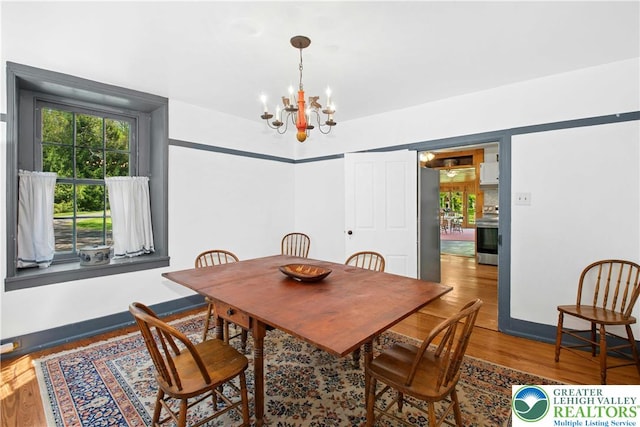 8043 Richlandtown Rd, East Rockhill Twp, PA 18951 - dining space featuring a chandelier, wood finished floors, and baseboards