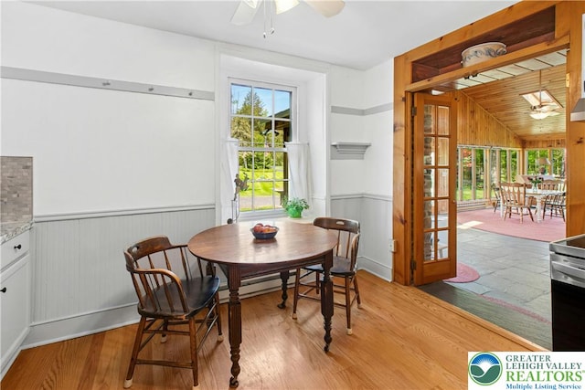 8043 Richlandtown Rd, East Rockhill Twp, PA 18951 - dining room with ceiling fan, wainscoting, light wood-style floors, and lofted ceiling